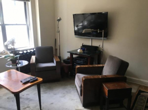 Upscale, large, high-ceilings, mid-town doorman NYC apartment centrally located